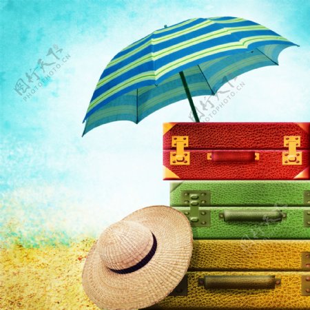 太阳伞与旅行箱草帽图片