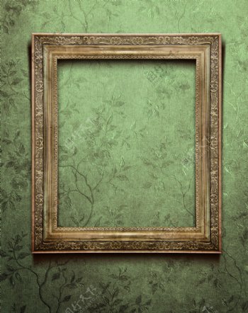 绿色花纹背景上的画框图片
