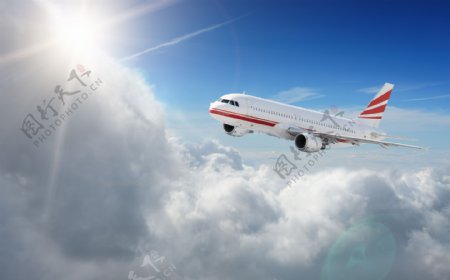 阳光云层上方的飞机图片