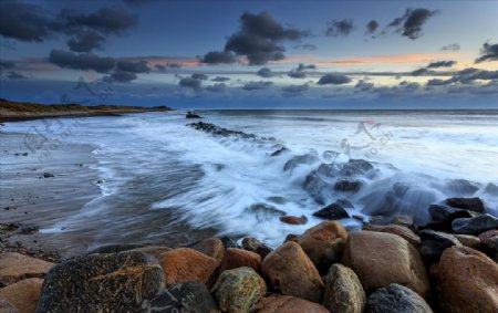 日落海海滩岩石
