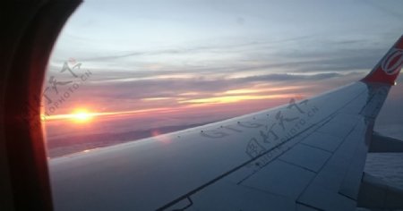 飞机天空飞行夕阳云彩
